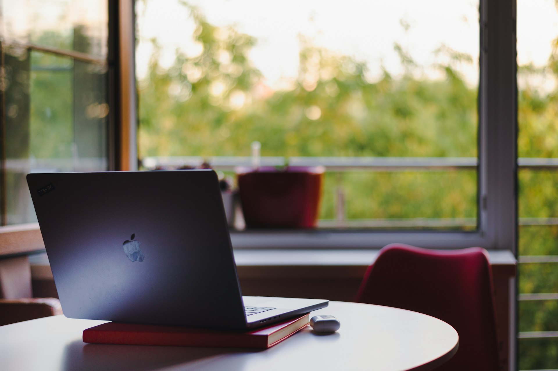 a laptop computer sitting on top of a white table